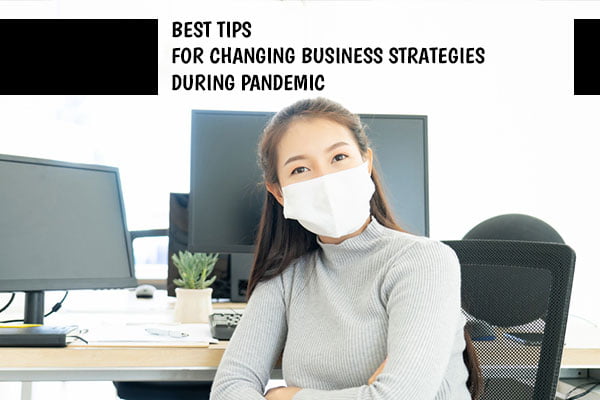 Best tips for changing Business Strategies during pandemic (A women with mask with computers in Background)