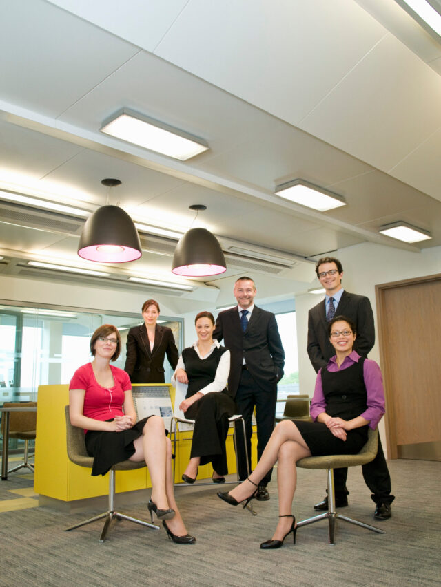 Business colleagues pose for photograph