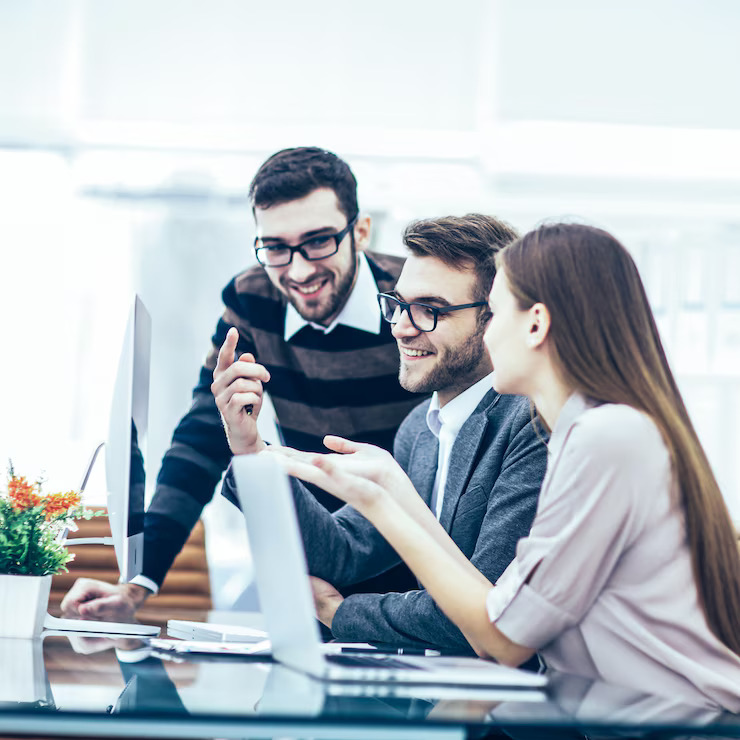 team-of-mobile-app-developers-in-saudi-arabia-collaborating-on-a-new-project-in-a-modern-office